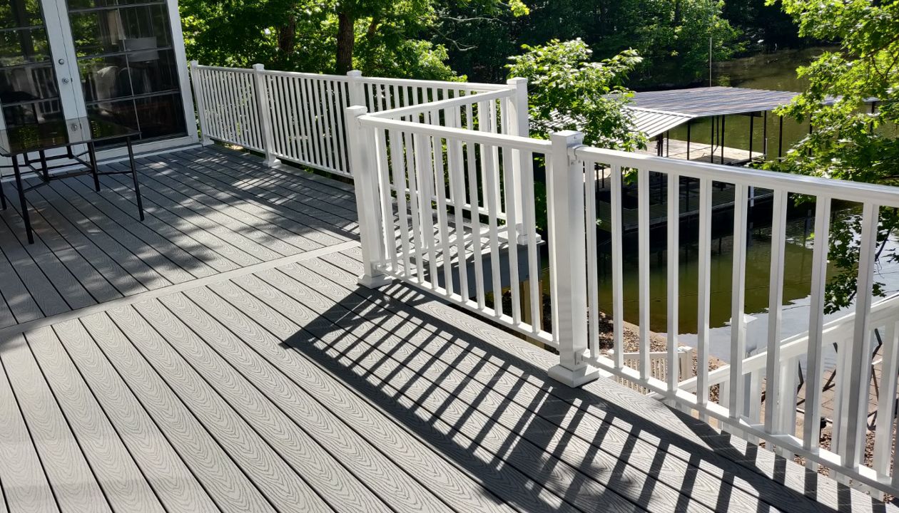 Pebble Grey Decking with White Aluminum Railing done in Sunrise Beach, MO at Lake of the Ozarks