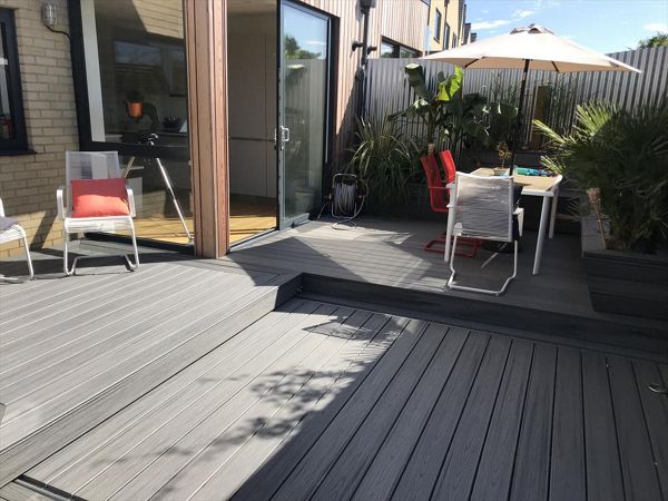 project outline: create an entertains space and hide a hot tub with a sliding floor as a sun deck.Materials Used:Trex Transcend Island Mist