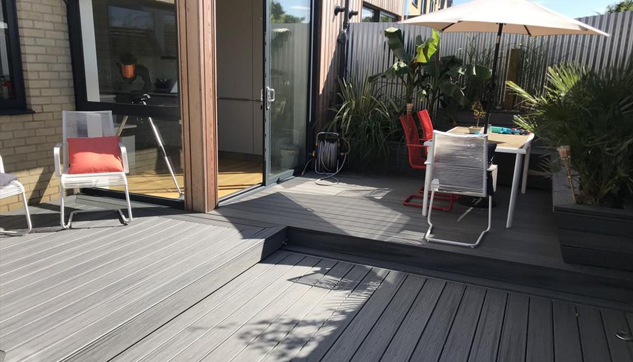 project outline: create an entertains space and hide a hot tub with a sliding floor as a sun deck.Materials Used:Trex Transcend Island Mist