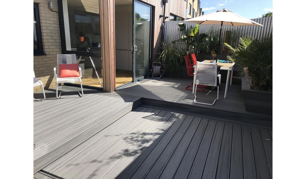 project outline: create an entertains space and hide a hot tub with a sliding floor as a sun deck.Materials Used:Trex Transcend Island Mist