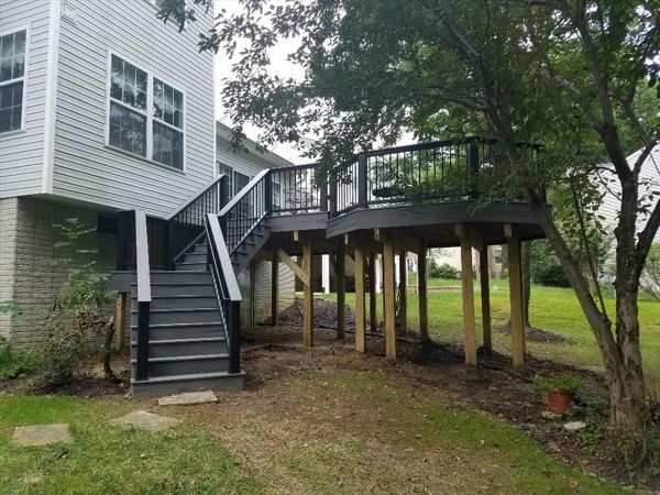 Trex Transcend Island Mist decking and matching Trex fascia. This multi level design features a custom angled staircase and Trex Transcend railings.