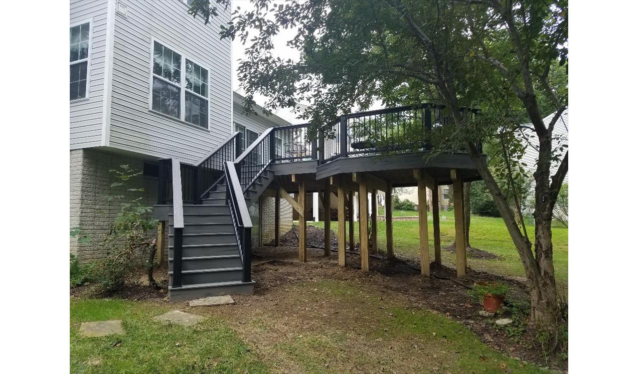 Trex Transcend Island Mist decking and matching Trex fascia. This multi level design features a custom angled staircase and Trex Transcend railings.