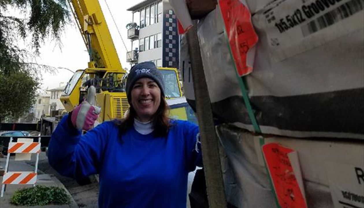 Monica of Fine Line poses with Trex for Oakland Penthouse, crane at the ready!