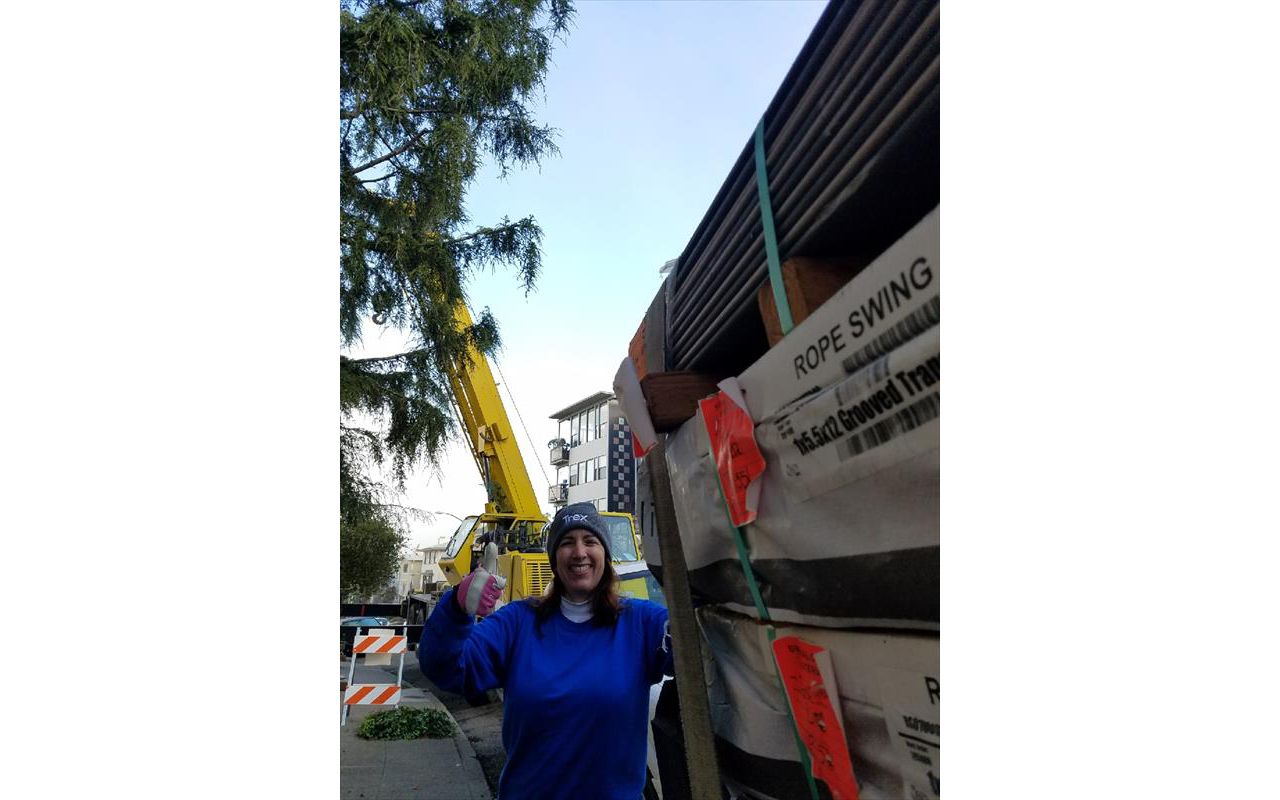 Monica of Fine Line poses with Trex for Oakland Penthouse, crane at the ready!