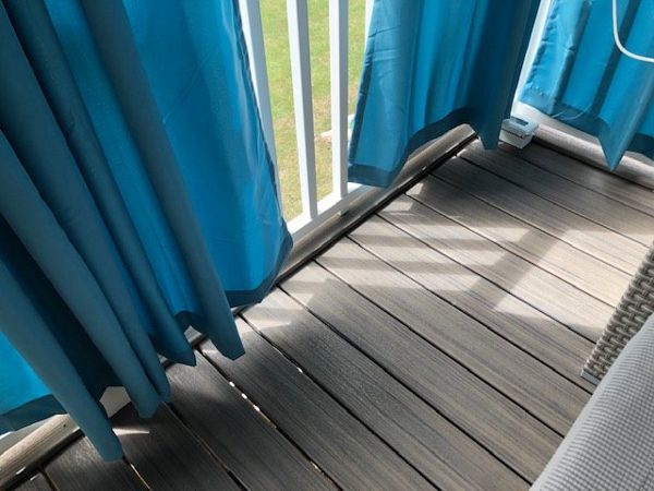 To add an extra aesthetic to this project, we trimed out the Trex Enhance Naturals Rocky Harbor decking with a ripped board on its surface