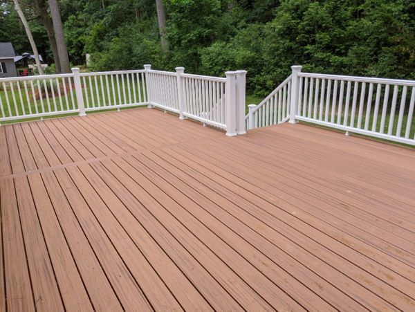 Trex Transcend "Tiki Torch" decking with white Transcend railings.