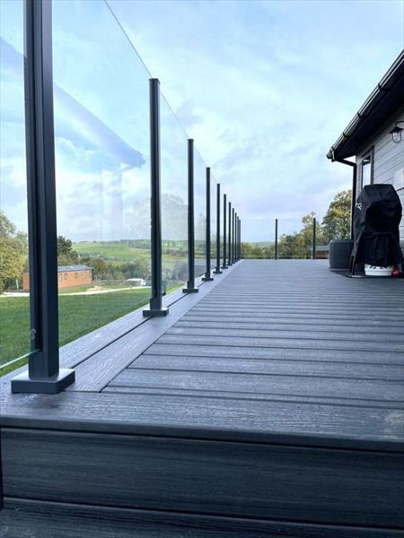 TREX Calm Water Decking with colour matched aluminium post & glass balustrade