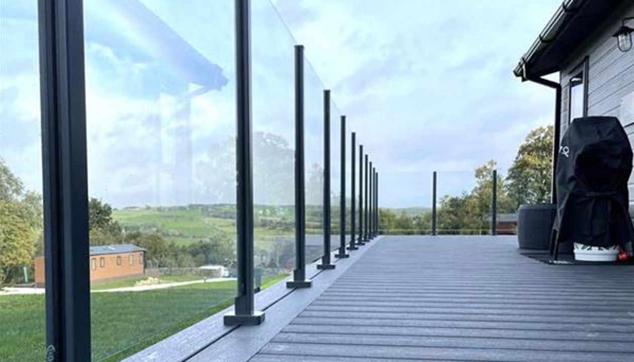 TREX Calm Water Decking with colour matched aluminium post & glass balustrade