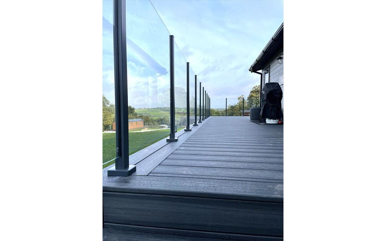 TREX Calm Water Decking with colour matched aluminium post & glass balustrade