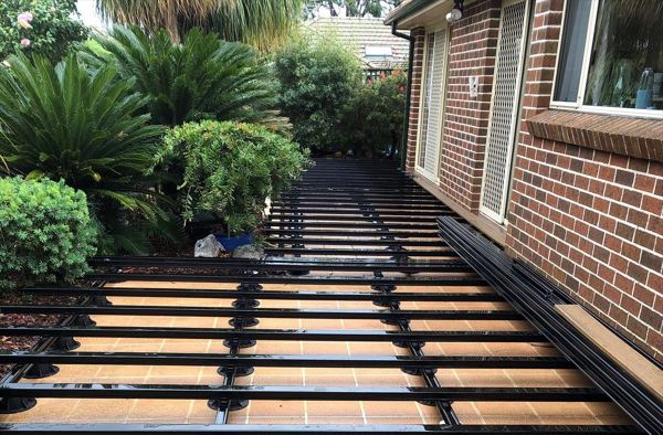 New substructure ready for installation of Trex Havana Gold deck boards that will complement the colour of the homes bricks