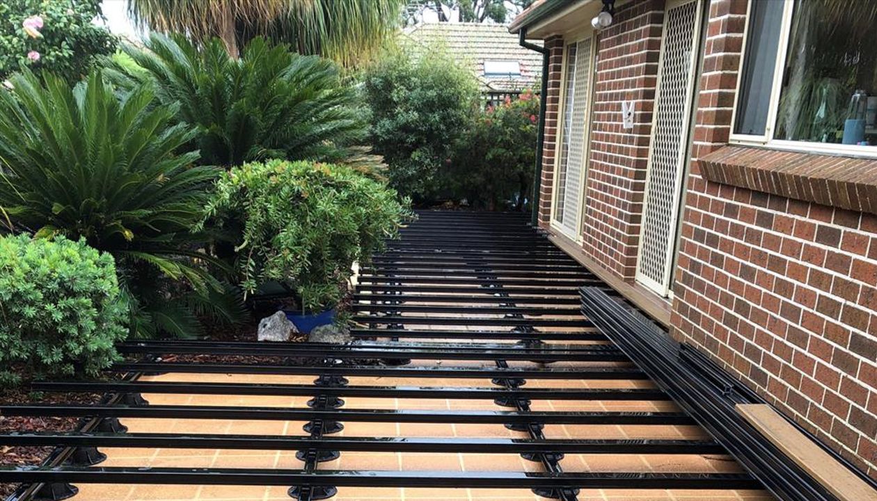 New substructure ready for installation of Trex Havana Gold deck boards that will complement the colour of the homes bricks