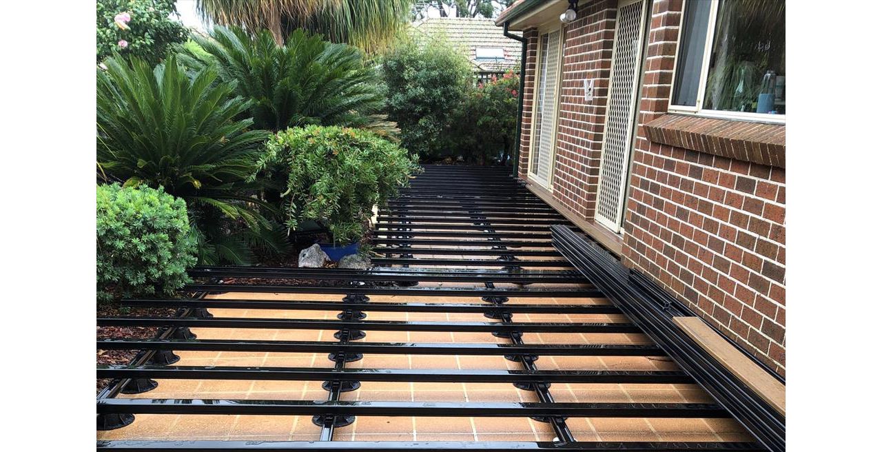 New substructure ready for installation of Trex Havana Gold deck boards that will complement the colour of the homes bricks