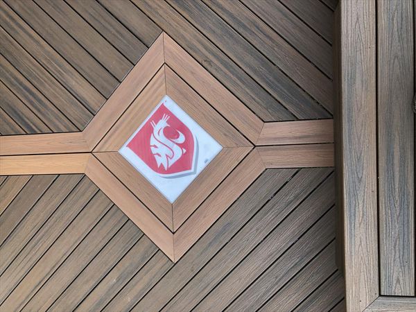 Trex Spiced Rum and Tiki Torch Decking with a Custom WSU inlay.