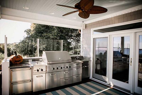 Custom outdoor kitchen area with Trex Transcend decking washing clean in case of any spills.