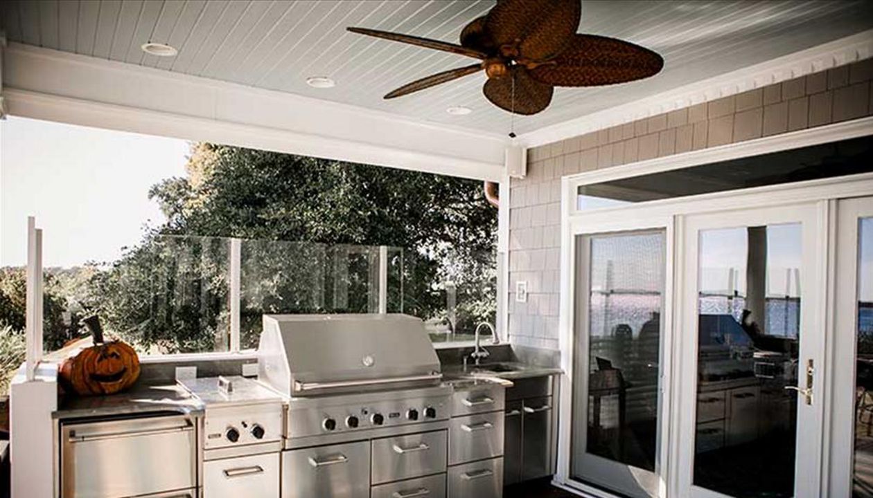 Custom outdoor kitchen area with Trex Transcend decking washing clean in case of any spills.