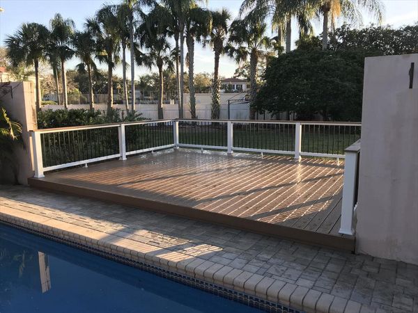 This pool deck is a nice place to dry off after a long swim. Trex Coctail railing allows for an easy transition to adult time providing the perfect place to rest that evening drink.