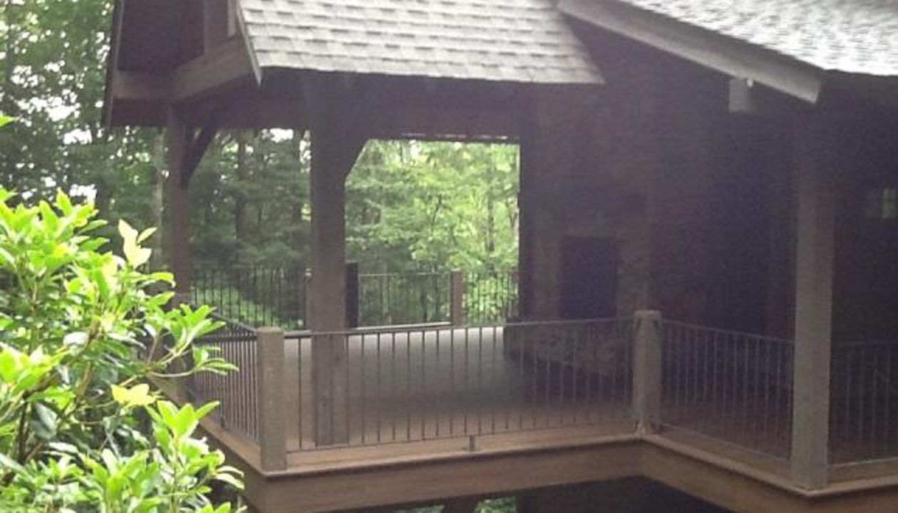 Trex Transcend Spiced Rum deck goes great with these rustic cedar columns.