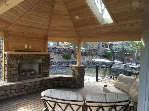 Spiced Rum decking, tongue and grove ceiling, custom fireplace and rail