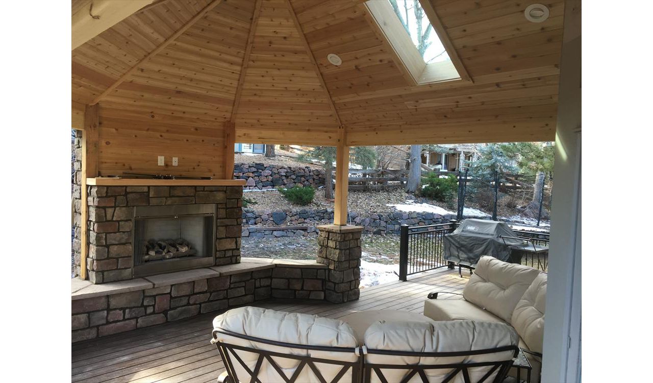 Spiced Rum decking, tongue and grove ceiling, custom fireplace and rail