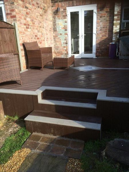 Small deck in Hale, Cheshire using Trex Transcend gravel path for the borders and Vintage lantern for the main body and skirting