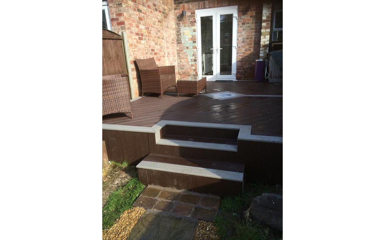 Small deck in Hale, Cheshire using Trex Transcend gravel path for the borders and Vintage lantern for the main body and skirting