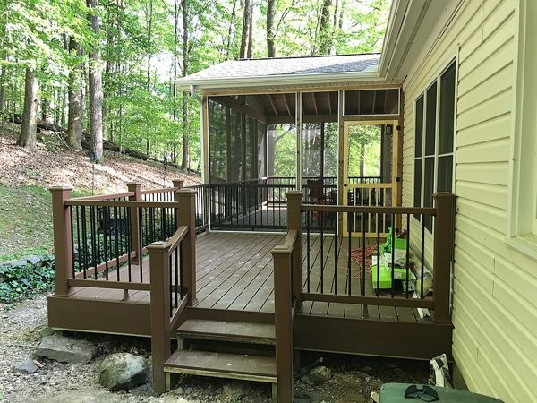 Trex deck with screened in space in the woods