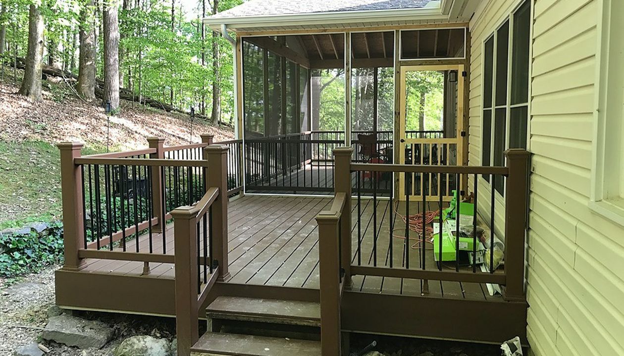Trex deck with screened in space in the woods
