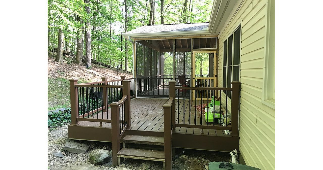 Trex deck with screened in space in the woods