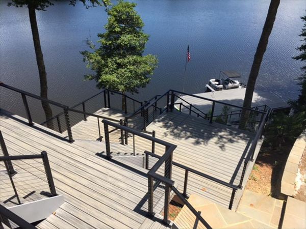 Trex deck and screened porch opens up down to a great set of stairs and a beautiful boat dock