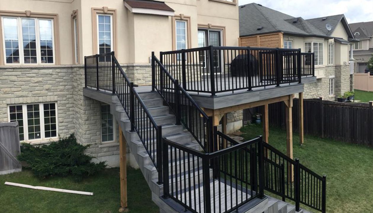 Two tier TREX Deck and stairs, with Island Mist colour. Built in:  Aurora, King City, Oak Ridges, Richmond Hill, Newmarket, Toronto, Mississauga, Mount Albert, Vaughan, Bradford, Stouffville