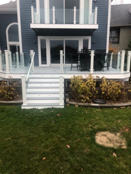 Foggy Wharf decking and border. White fascia. Stand alone glass with White posts. Commerce, Michigan