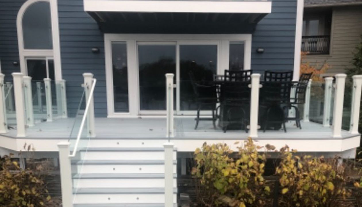 Foggy Wharf decking and border. White fascia. Stand alone glass with White posts. Commerce, Michigan