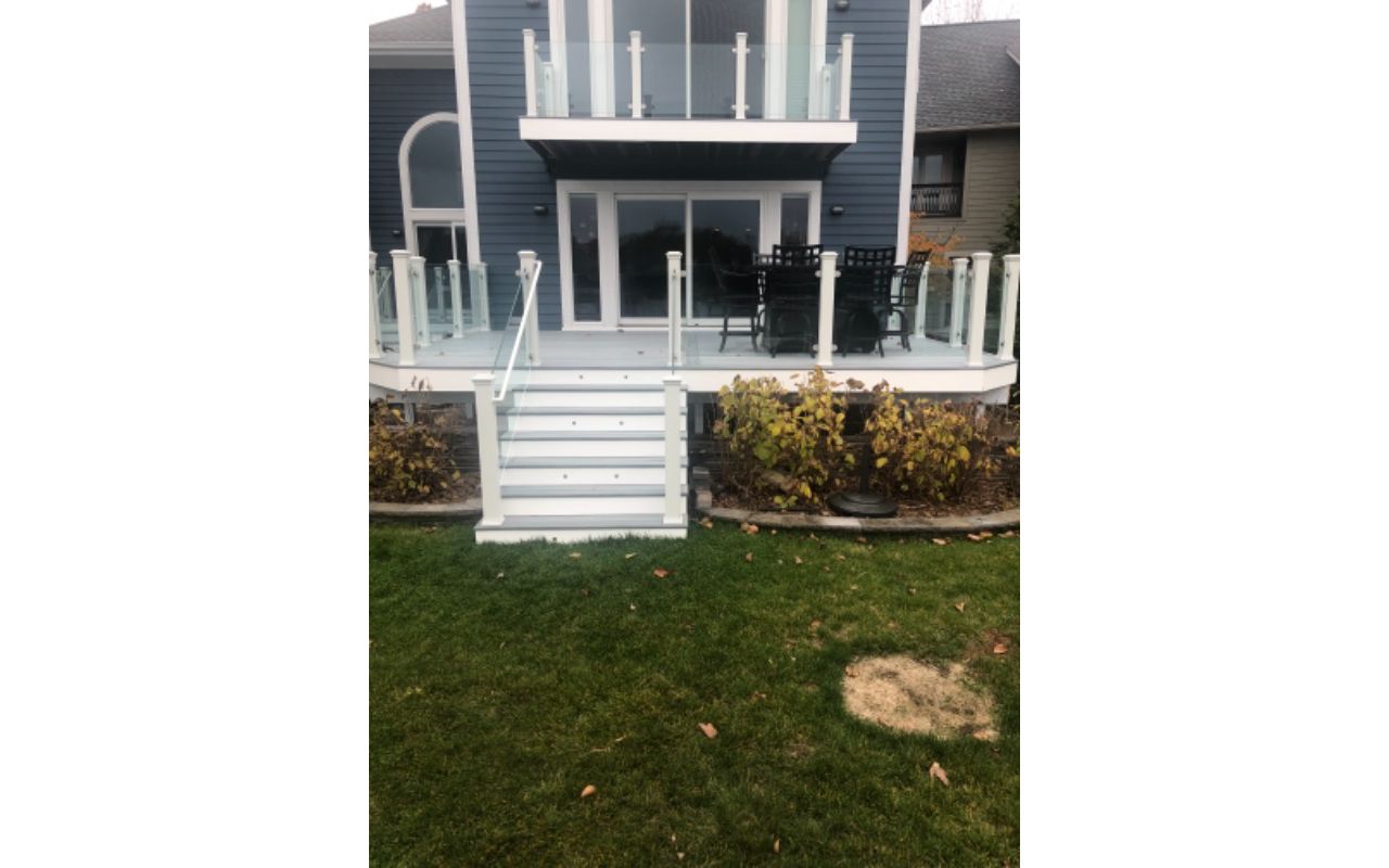 Foggy Wharf decking and border. White fascia. Stand alone glass with White posts. Commerce, Michigan