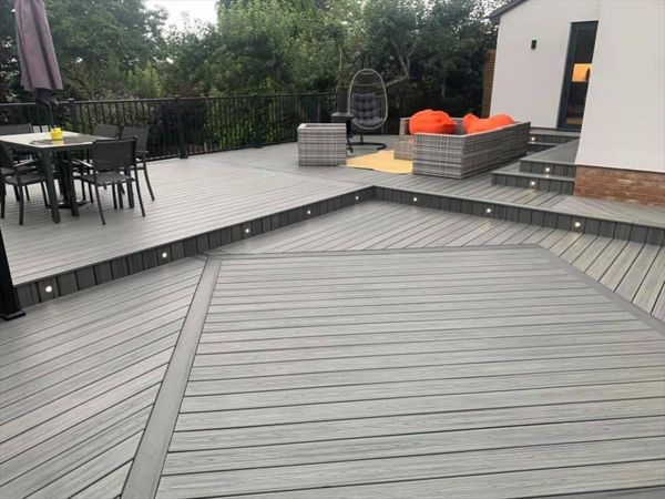 Trex transcend island mist decking, this outdoor living area was a massive transformation. A nice diamond inlay in calm water enhances this large area.