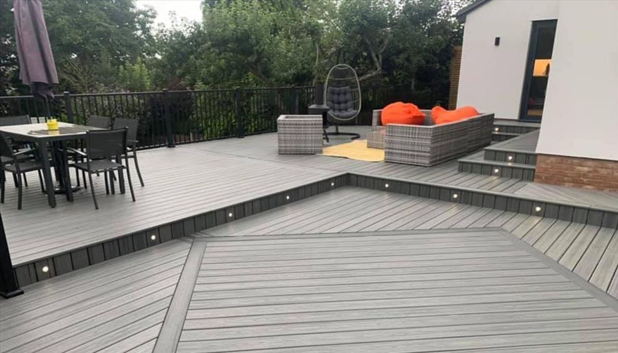 Trex transcend island mist decking, this outdoor living area was a massive transformation. A nice diamond inlay in calm water enhances this large area.