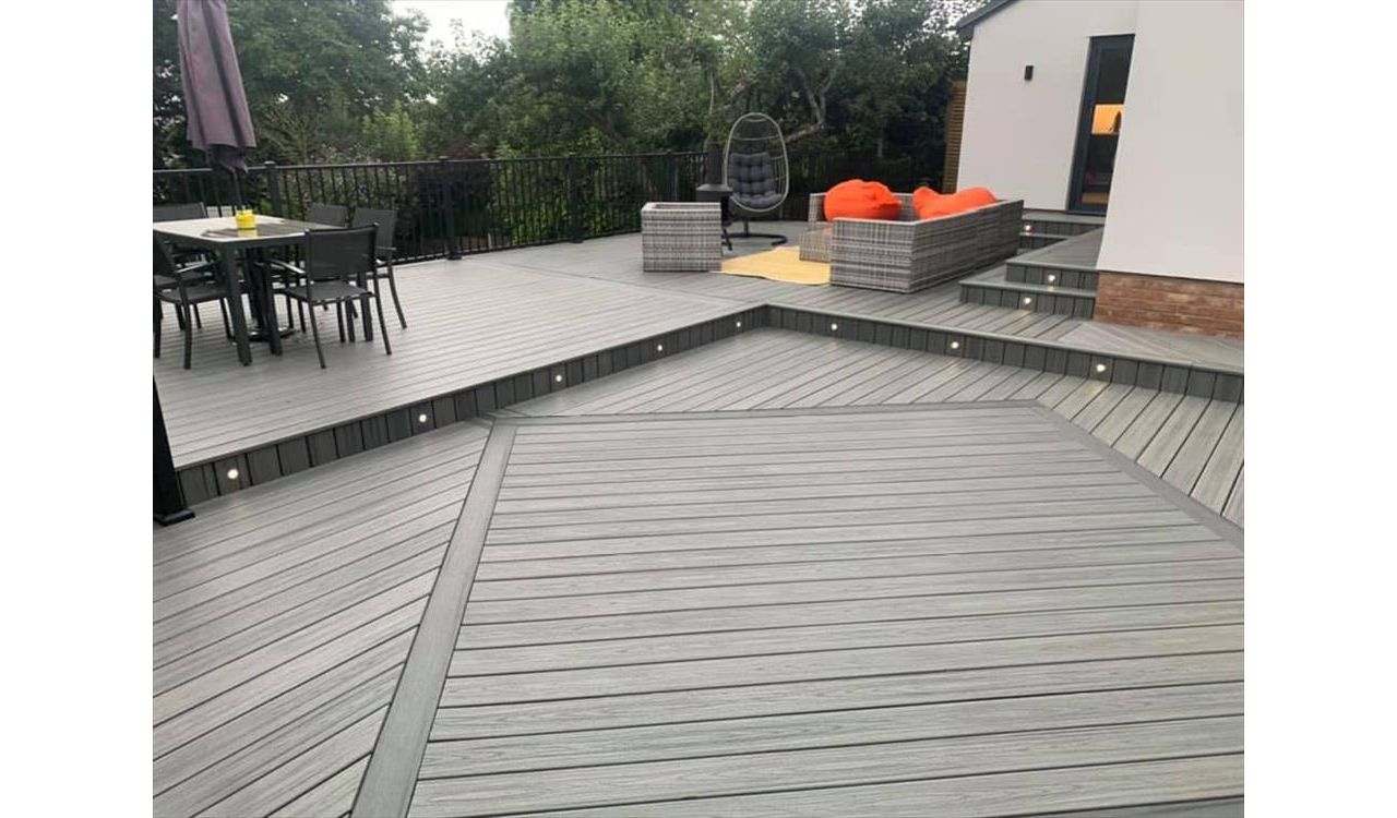 Trex transcend island mist decking, this outdoor living area was a massive transformation. A nice diamond inlay in calm water enhances this large area.