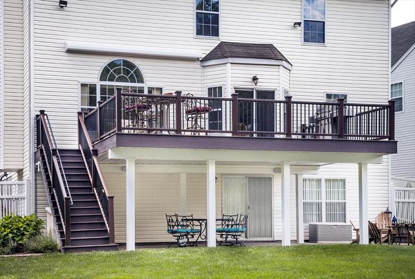 The Trex ADA-Compliant Handrail system blends seamlessly into the design of this railing system (Trex Transcend Vintage Lantern top and bottom railings with square black aluminum balusters) in Bridgewater, N.J.