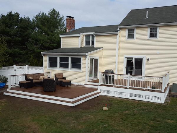 Select Saddle Decking, Transcend Railing with Low Voltage Lighting and White round balusters