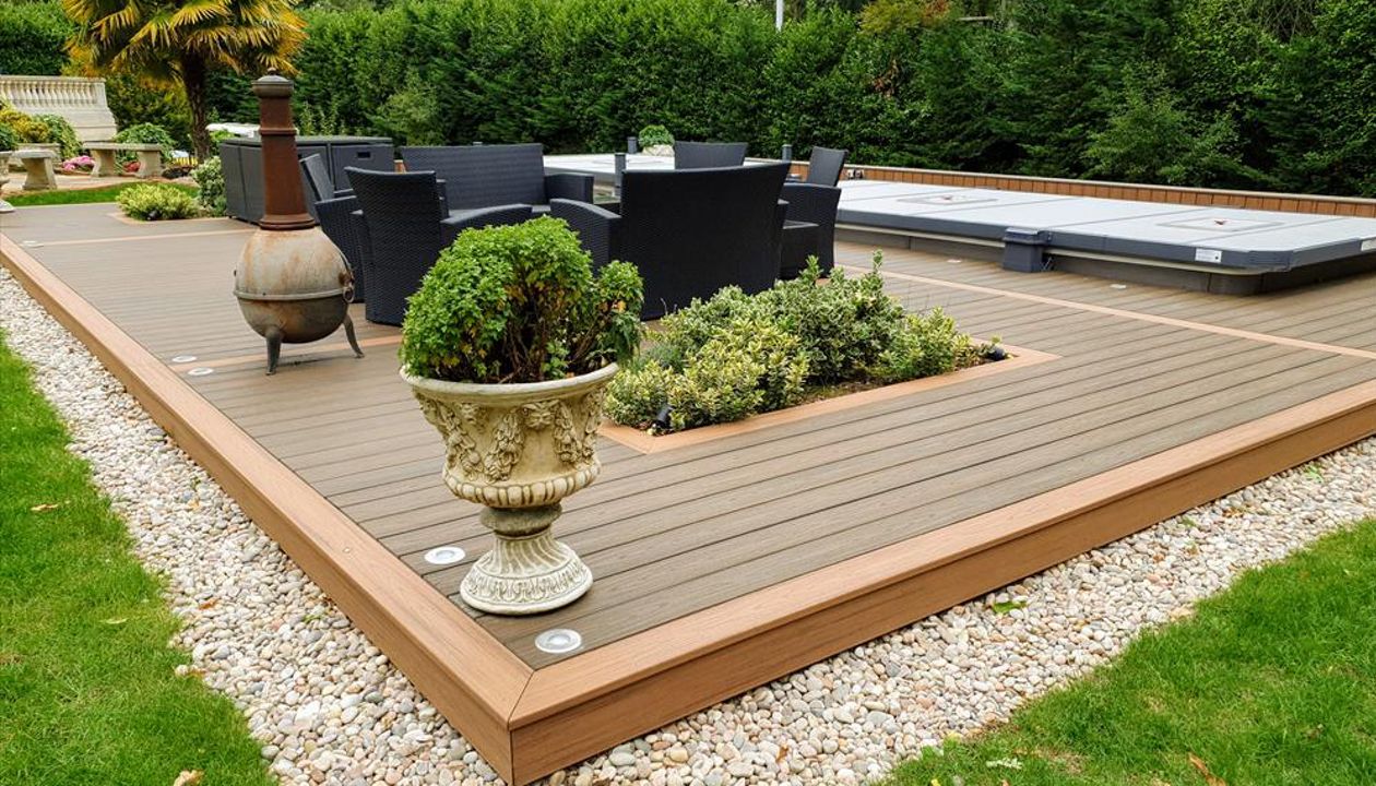 Trex Transcend Tiki Torch and Trex Transcend Spiced Rum Decking with Swimspa and hot tub in St George's hill , England UK