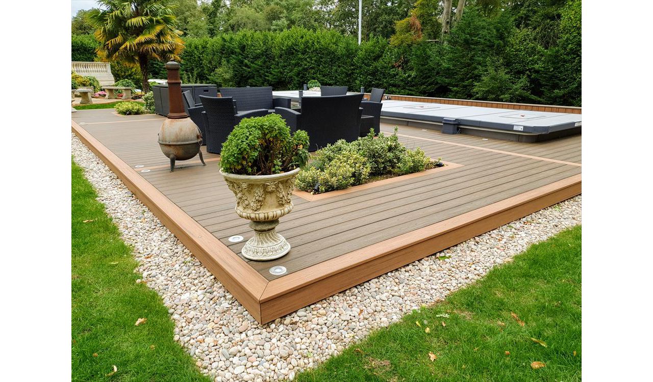 Trex Transcend Tiki Torch and Trex Transcend Spiced Rum Decking with Swimspa and hot tub in St George's hill , England UK