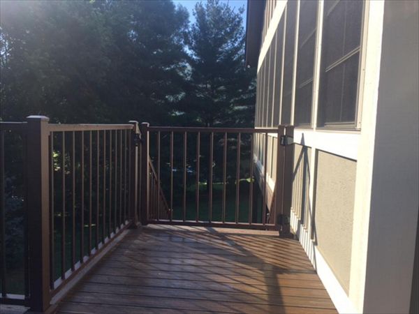 Trex Signature Bronze Aluminum Railing & gate stand up to the elements & help keep pets & kids in.