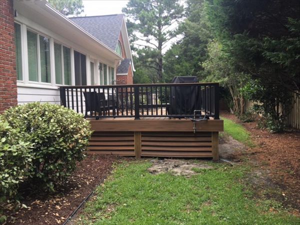 Trex Transcend Havana Gold decking goes great with the colors featured on the exterior of this home