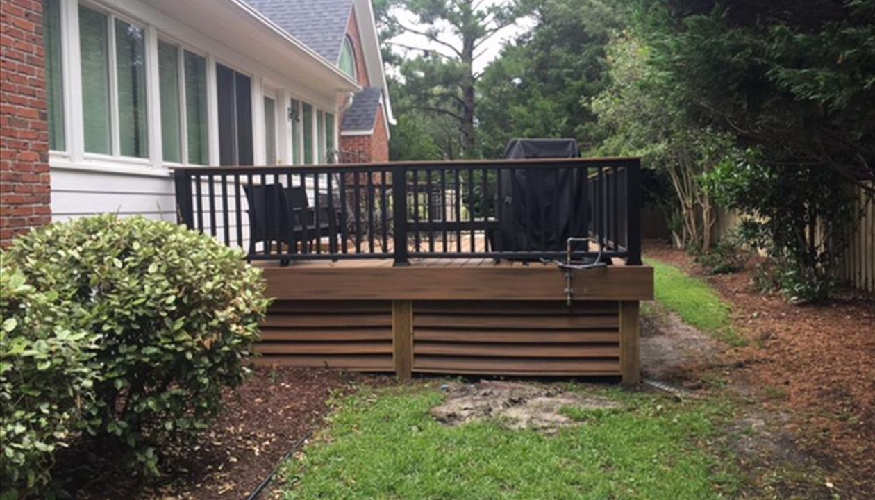 Trex Transcend Havana Gold decking goes great with the colors featured on the exterior of this home