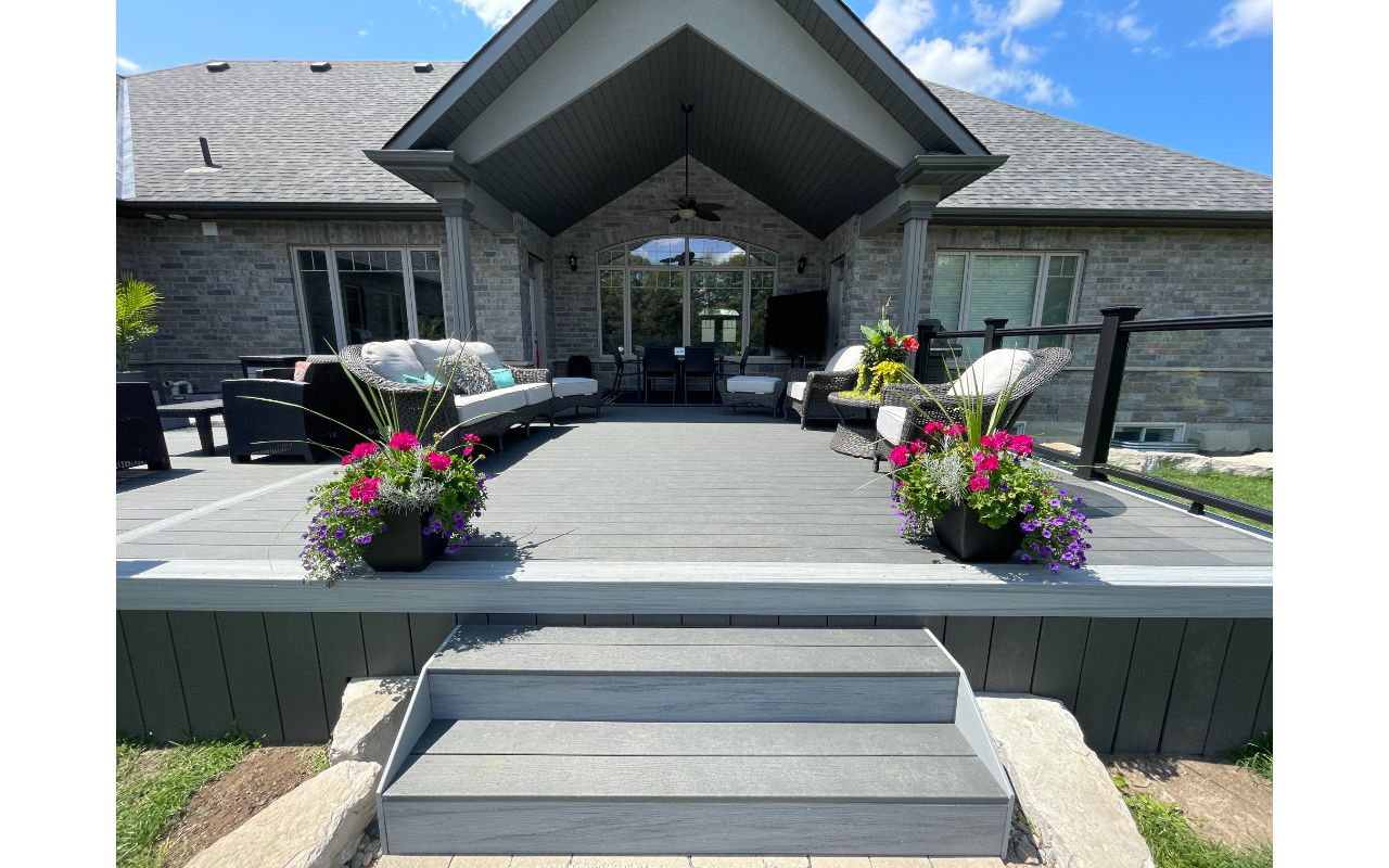 Main: Trex Enhance Basics in Clam Shell. Trim: Trex Enhance Naturals in Foggy Wharf. Contact Align Decking today for your custom composite decking needs. Servicing Toronto, Durham Region, Kawartha Lakes, and the Barrie & Orillia areas.