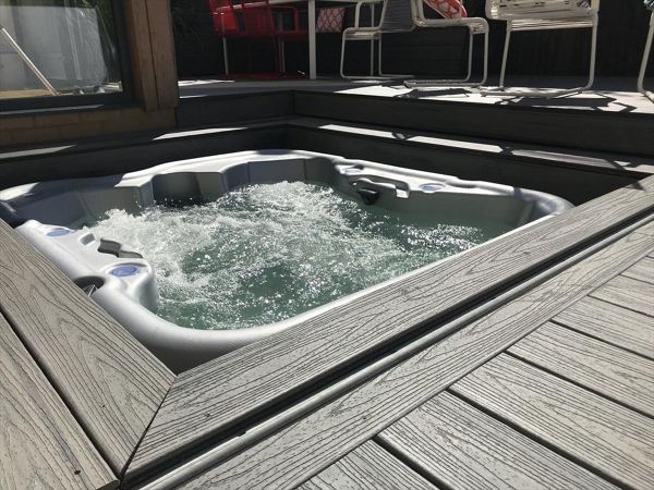 project outline: create an entertains space and hide a hot tub with a sliding floor as a sun deck.Materials Used:Trex Transcend Island Mist