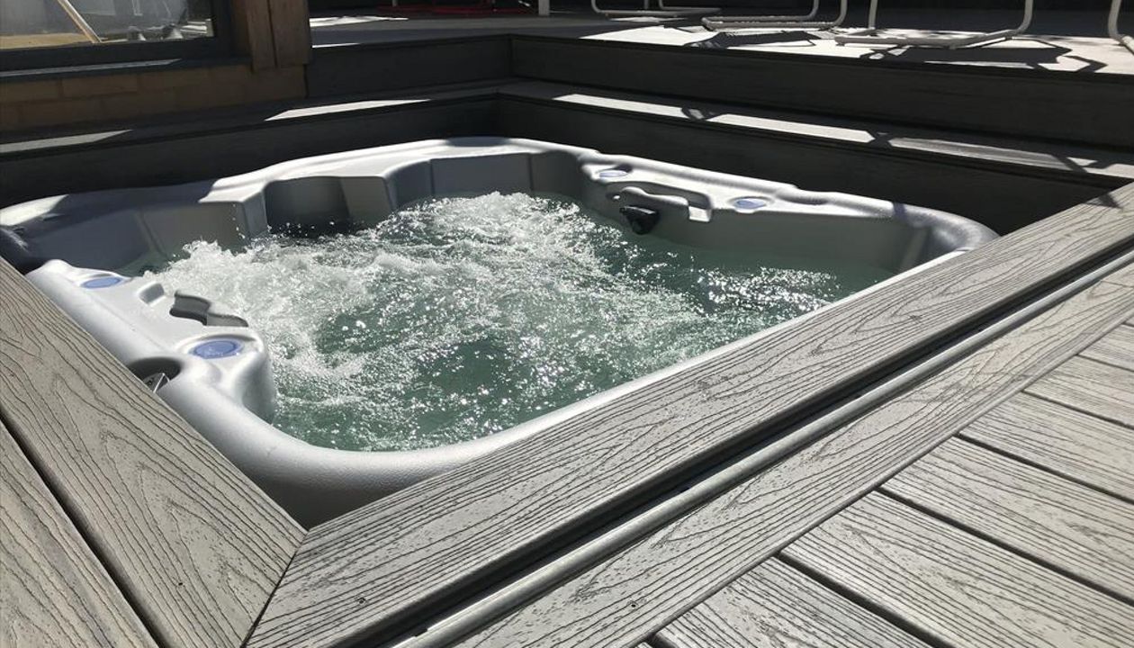 project outline: create an entertains space and hide a hot tub with a sliding floor as a sun deck.Materials Used:Trex Transcend Island Mist