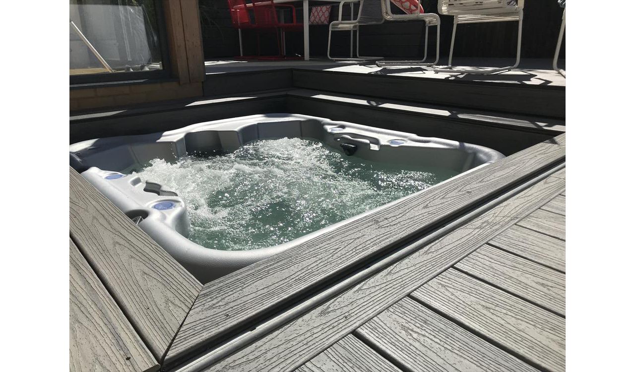 project outline: create an entertains space and hide a hot tub with a sliding floor as a sun deck.Materials Used:Trex Transcend Island Mist
