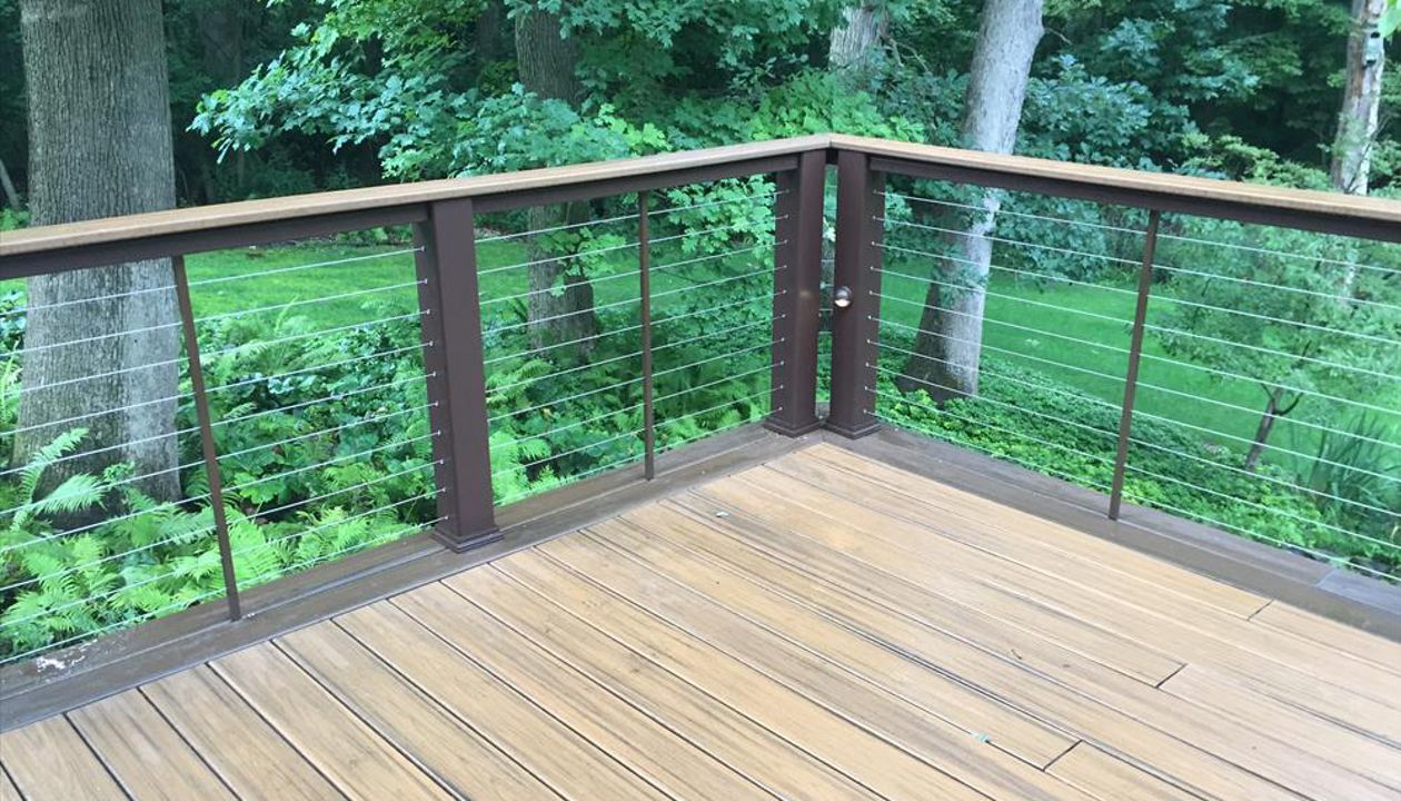 Havana Gold Transcend with Spiced Rum Border. Vintage Lantern Posts, Havana Gold Cocktail Railing. Cable Railing with Custom Powder Coated Spacers. Hidden Fasteners.