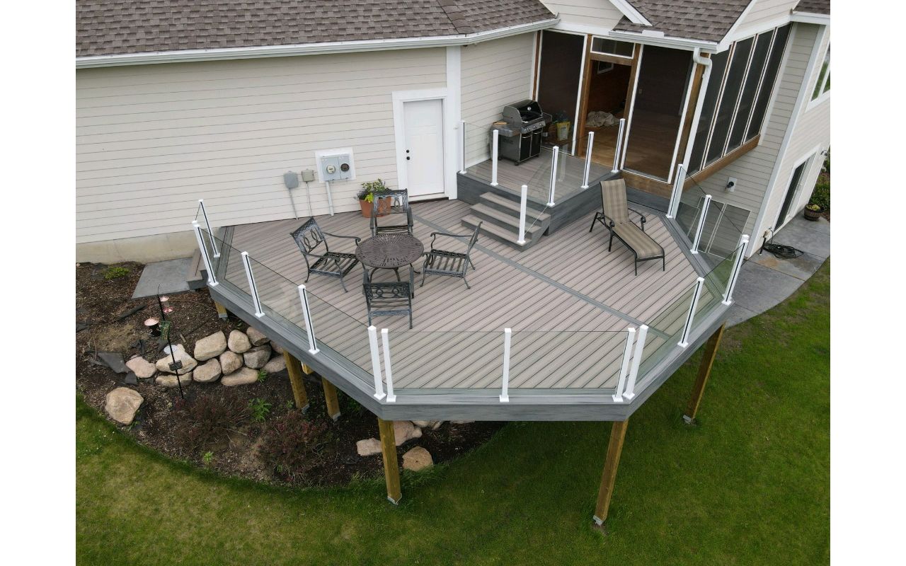 Trex deck with custom glass panel rail in Prior Lake