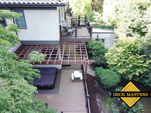 Portland Deck featuring Trex Havana Gold, Transcend Railing, Trex Lighting, Fascia, Trex Spiral Staircase.